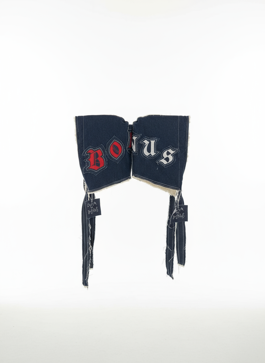 Button / fastening detail — premium handcrafted denim hood with lettering embroidered in red or white, winter denim accessory for men and women. 